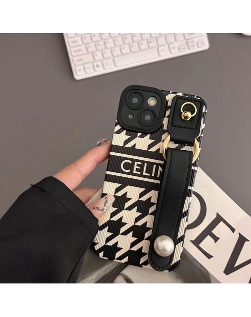 celine ブランド セリーヌ iphone14/14 pro/14 pro maxケース 黒白色  ハンドバンド付 モノグラム レザー製 ジャケット型 リング付 アイフォン14プロ マックス/14プロ/14/13/12/11/x/xs/xrカバー ペアお揃い ファッション 高級 メンズ レディース